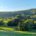 Blick auf den Golfplatz Zierenberg mit Windrädern im Hintergrund